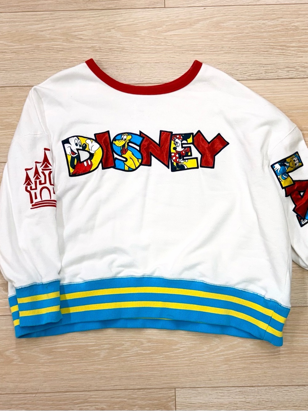 Disney White Sweatshirt with Red Trim and Blue-Yellow Hem